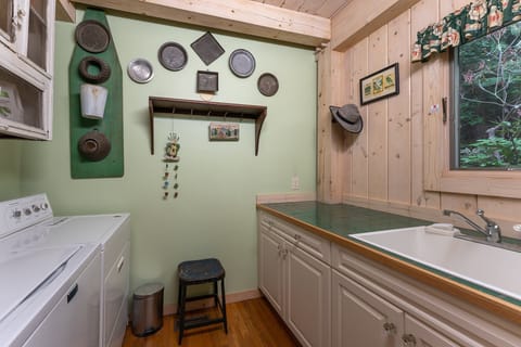 Main level laundry room with washer & dryer.