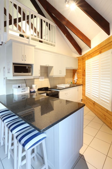 Wheelchair Friendly Chalet | Private kitchen | Fridge, microwave, oven, stovetop