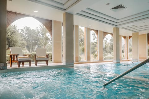 Indoor pool, outdoor pool, pool umbrellas, sun loungers