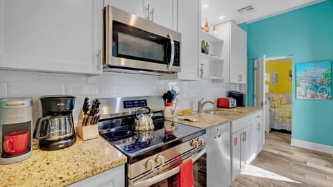 The kitchen has plenty of cabinet and counter space...