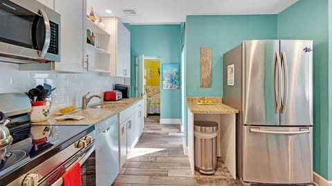 The kitchen sits off the living area with luxury appliances and tools...