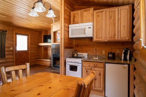 Two Bedroom Riverfront Cabin | Private kitchen | Microwave, coffee/tea maker