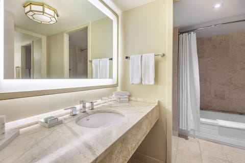 Premier Room, 1 King Bed | Bathroom | Combined shower/tub, rainfall showerhead, designer toiletries
