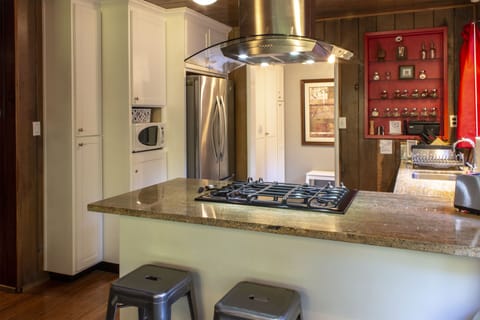 The open kitchen keeps everyone in the conversation - or helping with meals.