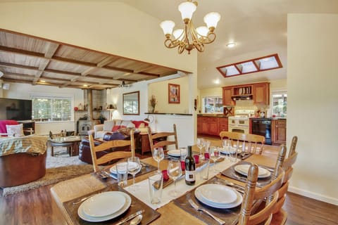 The open floorplan upstairs encourages free flowing conversation from the kitchen to the dining and living areas.