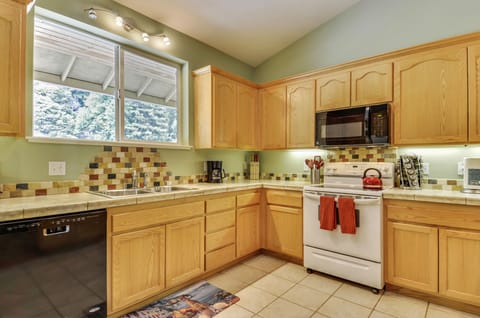 The main house kitchen has all the appliances and utensils you need for feeding the whole family.