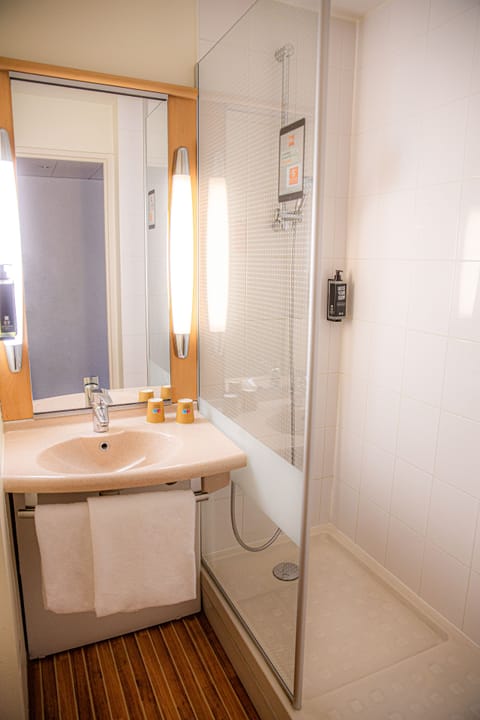 Shower, eco-friendly toiletries, hair dryer, towels