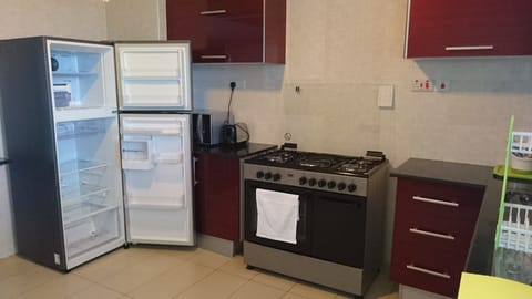 Executive Apartment, 3 Bedrooms, Balcony | Private kitchenette | Full-size fridge, microwave, oven, stovetop