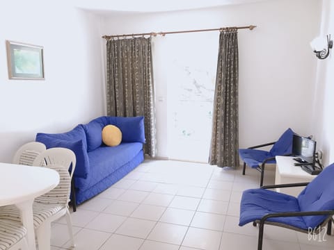 Standard Apartment, 1 Bedroom | Living area | Flat-screen TV