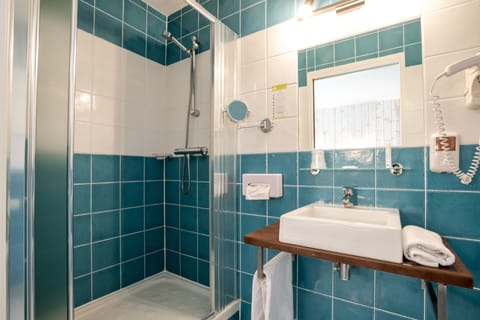 Shower, free toiletries, hair dryer, towels