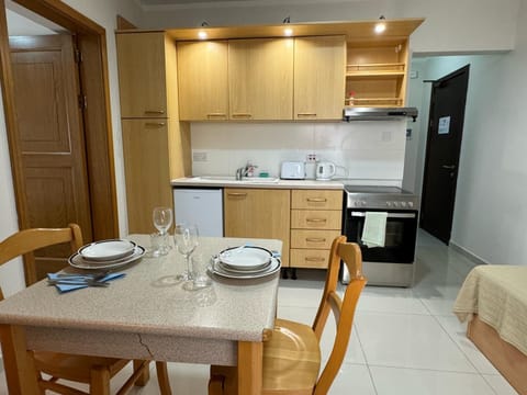 Apartment, 1 Bedroom (1 Bed Sleeps 2) | Desk, iron/ironing board, free cribs/infant beds, rollaway beds