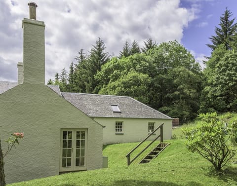 Gardener's Cottage - side aspect with steps leading up to the lawned garden
