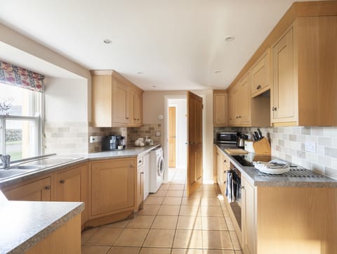 The Bothy at Swinton Hill - the bright kitchen leading through to entrance hall