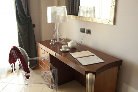 Standard Triple Room | Minibar, in-room safe, desk, soundproofing