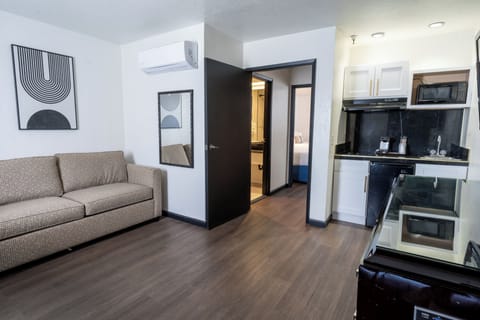 Suite, Multiple Beds, Kitchenette | Pillowtop beds, blackout drapes, iron/ironing board, free WiFi