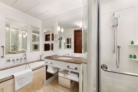Separate tub and shower, designer toiletries, hair dryer, bathrobes