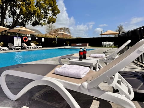 Outdoor pool, open 9:00 AM to 7:00 PM, pool umbrellas, sun loungers