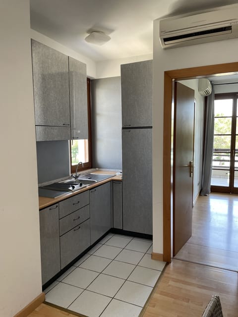 Panoramic Condo | Private kitchen | Full-size fridge, stovetop, cookware/dishes/utensils