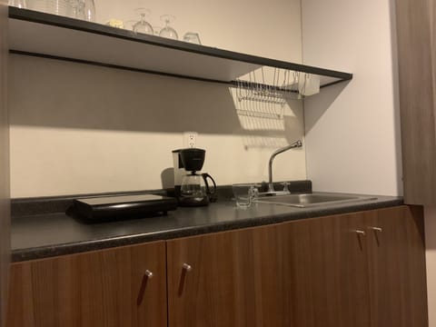 Fridge, microwave, stovetop, coffee/tea maker