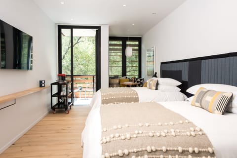 Room, 2 Queen Beds | Minibar, in-room safe, free cribs/infant beds, bed sheets