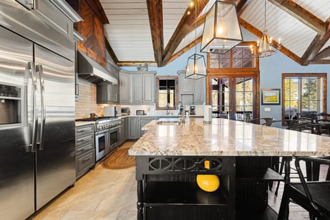 Full size kitchen offering stainless steel appliances and granite countertops.