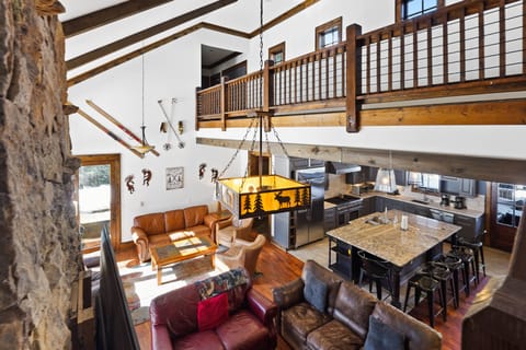 Overlooking living, dining and kitchen areas.