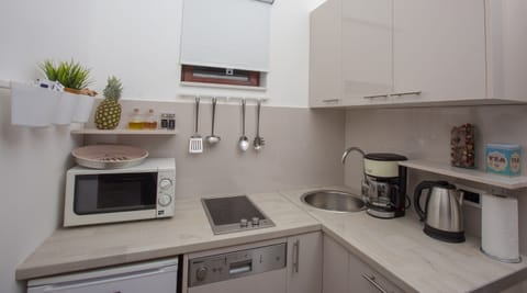 Apartment, 2 Bedrooms | Private kitchenette | Fridge, microwave, stovetop, dishwasher