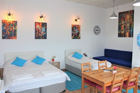 Economy Triple Room, 1 Bedroom, Non Smoking, Partial Sea View | Individually decorated, individually furnished, laptop workspace