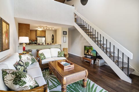 Kitchen and staircase leading to upper floor loft bedroom and en-suite bath