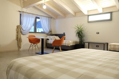 Comfort Quadruple Room | Down comforters, memory foam beds, in-room safe, individually furnished