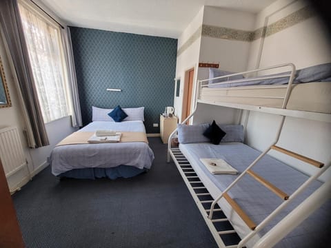 Family Room, Multiple Beds, Ensuite | Iron/ironing board, free WiFi, bed sheets