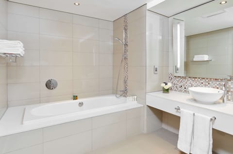 Junior Suite, 1 King Bed | Bathroom | Separate tub and shower, deep soaking tub, free toiletries, hair dryer
