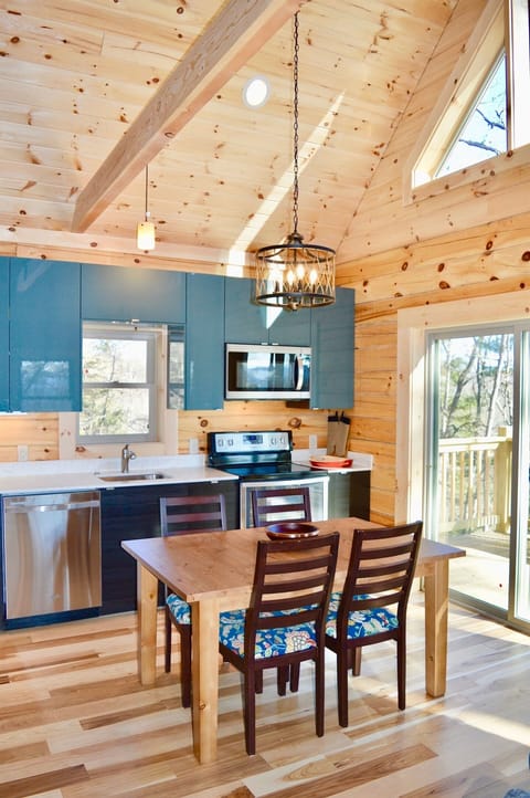 Dining table. Additional leaf can be added to seat eight, extra chairs available