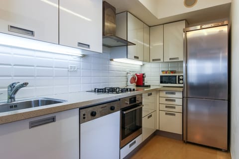 Family Apartment, 3 Bedrooms, Balcony | Private kitchen | Full-size fridge, microwave, oven, stovetop