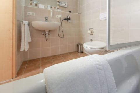 Deep soaking tub, rainfall showerhead, hair dryer, bathrobes