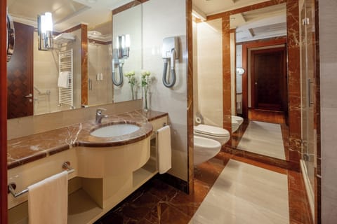 Superior Studio | Bathroom | Separate tub and shower, rainfall showerhead, hair dryer, bidet