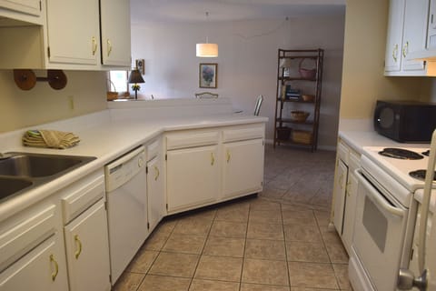 From back of the kitchen lookin gout towards the dining area.