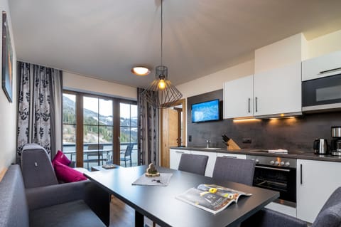 Classic Apartment | Living area | 32-inch flat-screen TV with cable channels, TV, heated floors