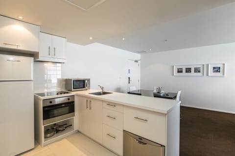 Suite, 2 Bedrooms | Private kitchen | Fridge, microwave, stovetop, dishwasher