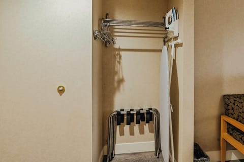 Premium bedding, desk, laptop workspace, blackout drapes