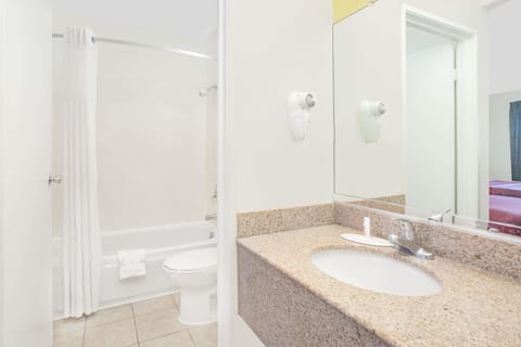 Standard Room, 2 Queen Beds | Bathroom | Combined shower/tub, hair dryer, towels