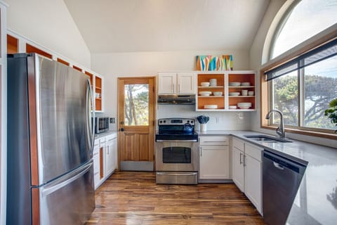 Stainless steel top-flight appliances and amazing natural light in the spacious kitchen.
