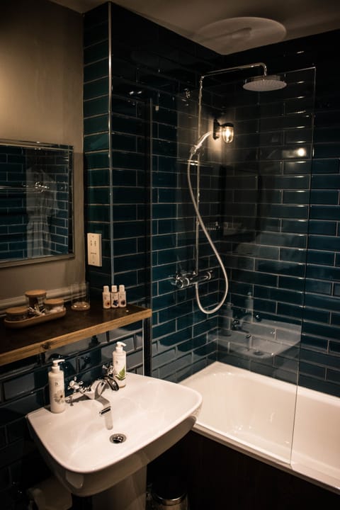 Suite | Bathroom | Designer toiletries, hair dryer, bathrobes, towels