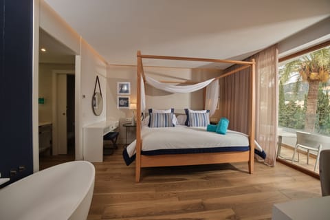 Deluxe Suite, Balcony, Sea View | Premium bedding, down comforters, minibar, individually decorated