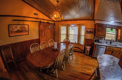 Dining Room open concept with the Kitchen with Laundry Room to the back door