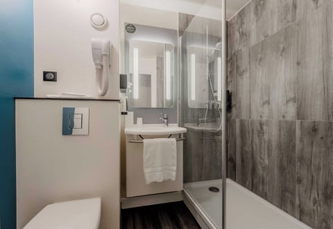 Shower, eco-friendly toiletries, hair dryer, towels