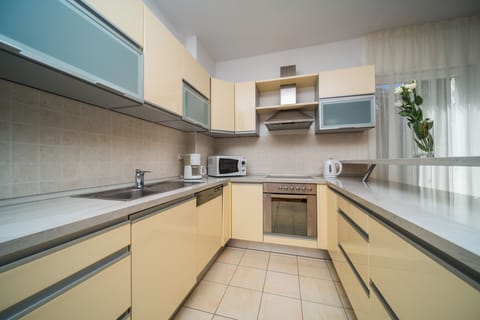 Comfort Apartment, 2 Bedrooms, Balcony (6 adults) | Private kitchen | Full-size fridge, microwave, stovetop, dishwasher