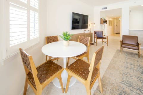 A table for 4 in the living room with amazing views of the Gulf of Mexico.
