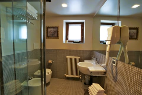 Superior Triple Room | Bathroom | Shower, hair dryer, bidet, towels