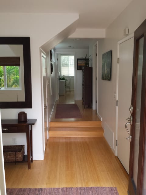 Entry to your beach vacation with bamboo floors and coastal furnishings